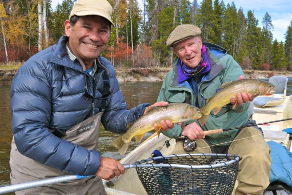 Snake River fly fishing guides and clients with trout in hand