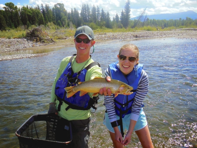 Snake River guide with female client trout in hand