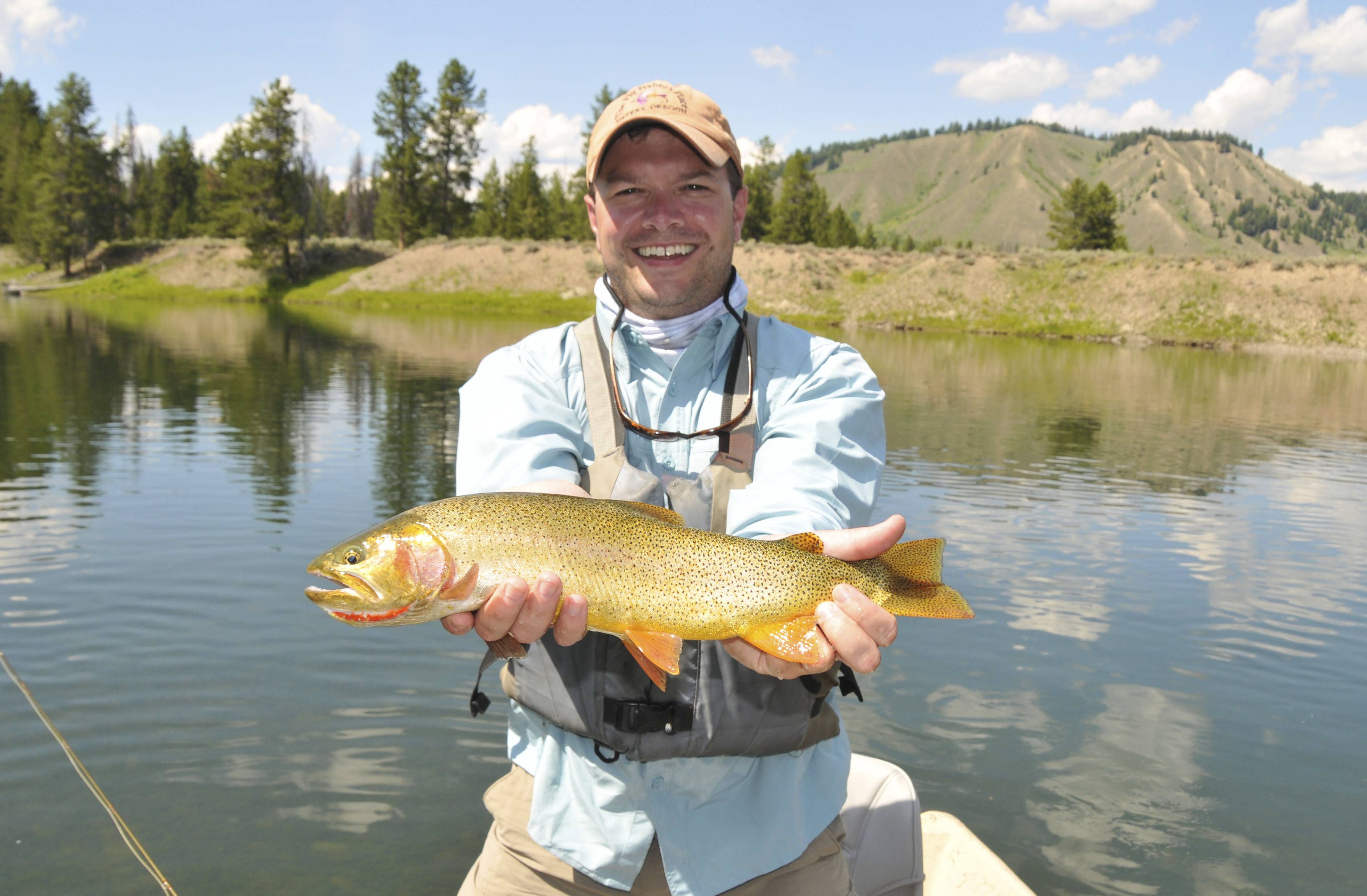 Snake River happy client with trout in hand