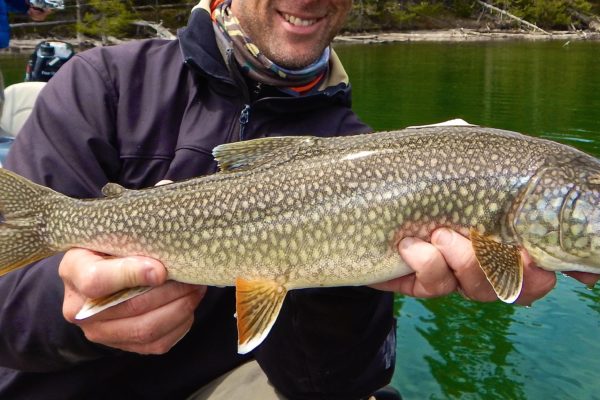 yellowstone lake fishing guides happy client with trout